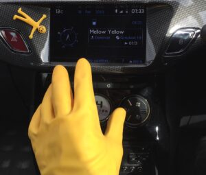 Hand-yellow-rubber-glove-driving-car-by-john-griffiths-colby
