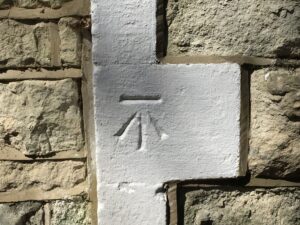 ordnance-survey-arrow-pushing-up-against-bar-by-John-Griffiths-Colby